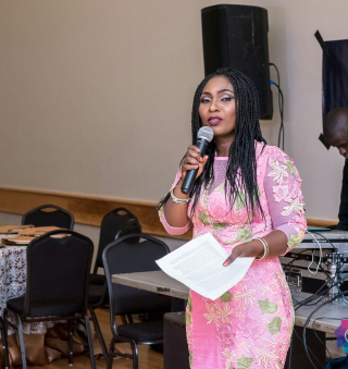 Patience Ndidi Key speaking at a community event